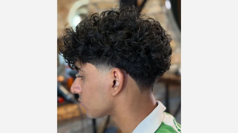 40 Stylish Taper Fade Curly Hair Ideas for Men 16 Mid Taper with Voluminous Curls