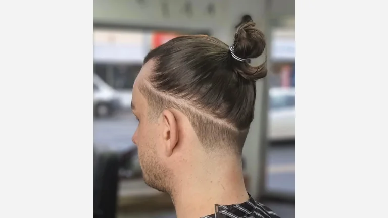 40 Stylish Taper Fade Curly Hair Ideas for Men 17 Taper Fade with Ponytail