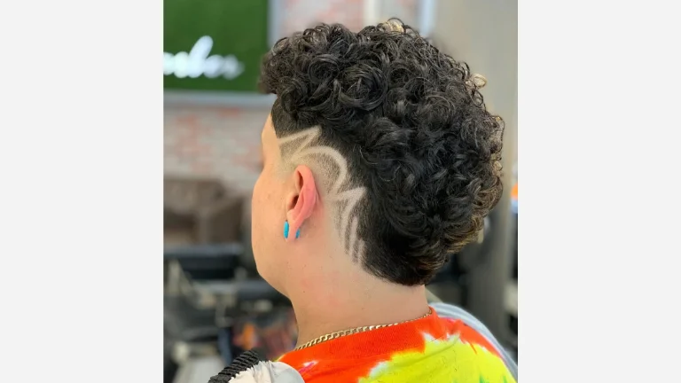 40 Stylish Taper Fade Curly Hair Ideas for Men 5 Burst Fade with Graffiti Design