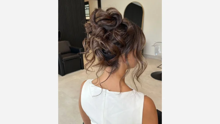 30 Elegant Prom Hairstyles for a Glamorous Look 9 Textured High Bun with Loose Curls